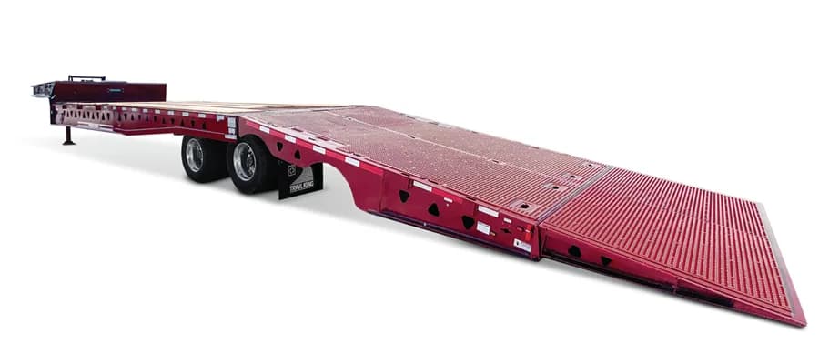 Trail King TKHST Hydraulic Sliding Tail trailer with hydraulic lowering tail, 20,000-lb winch, and dual-side controls for easy equipment loading.